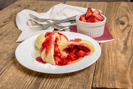 Traditional czech strawberry dumpling with hot butter and jamの写真素材