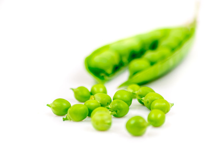 Many raw open pea isolated on white backgroundの写真素材