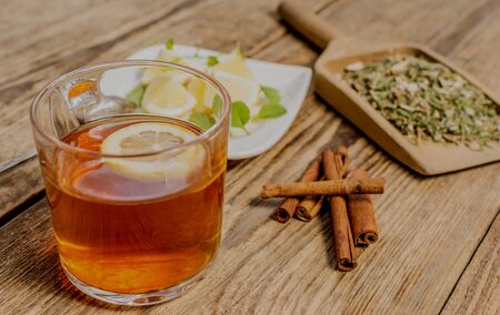 Cup of herbal tea with lemon and mintの写真素材