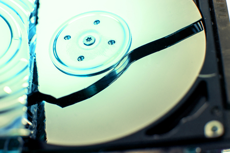 Broken and open computer or laptop hard drive