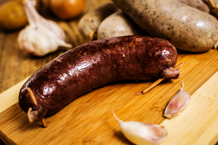 Czech traditional blood sausage and sausage meat on woodの写真素材