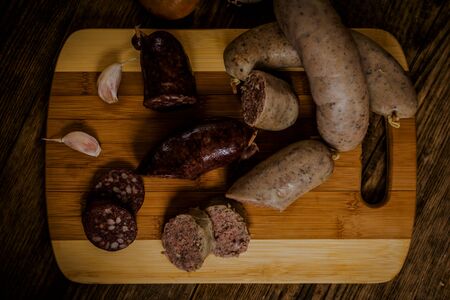 Czech traditional blood sausage and sausage meat on woodの写真素材