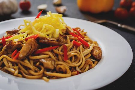 Asian noodles with chicken meat and vegetablesの写真素材
