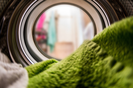 Color clothes in washing machine. inside view