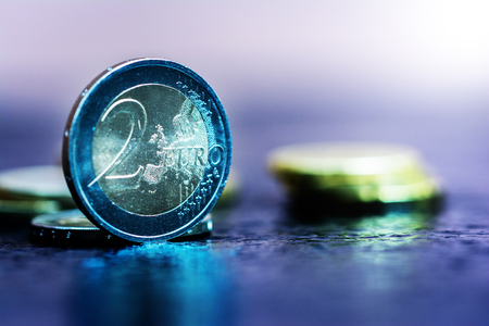 Virtual currency Bitcoin and Euro coin on dark tableの写真素材