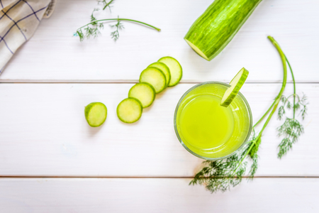 Green Healthy drink from fresh cucmber on white tableの写真素材