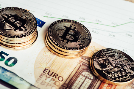 Golden  coins of crypto currency Bitcoin and Euro paper moneyの写真素材