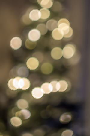 Abstract bokeh background with old lens photography yellow christmas treeの写真素材