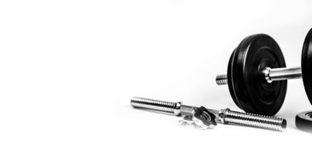 Black chrome dumbbell or barbell on white backgroundの写真素材