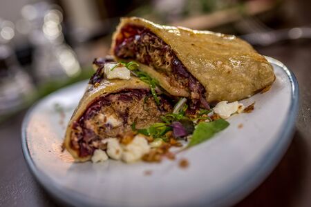 Tortilla with pork meat and red cabbage