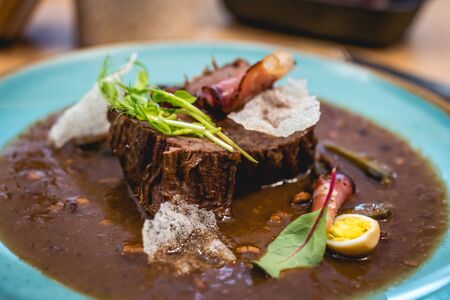 beef Brisket with bacon and quail eggsの写真素材