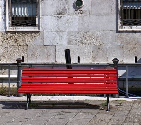 Red bench in the parkの写真素材