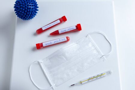 test tube, medical mask, thermometer, inscription virus, coronavirus study, virus research
