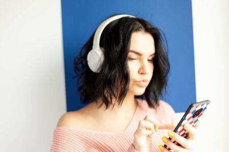 the girl in the headphones listens to music, concept of online media content service, online musicの写真素材