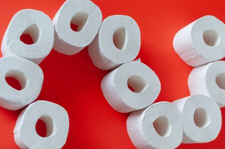 Rolls of toilet paper on color background
