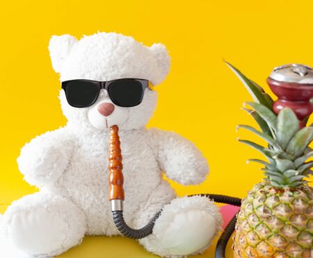 a teddy bear smokes a shisha, black sunglasses are on the bear, pineapple hookah, bright yellow...
