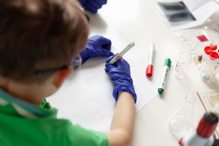 violet dumbbell on a pink background on a yellow backgroundの写真素材