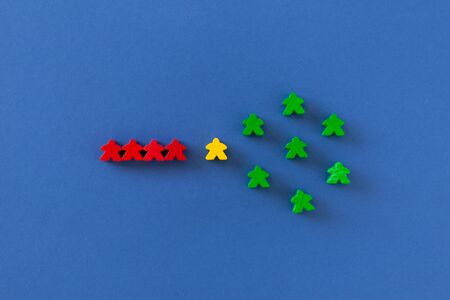 figures of people of different colors on a background of classic blue