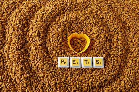 a lot of pet food, on top of the heart and the word pets, love for animals, pet care, pet food