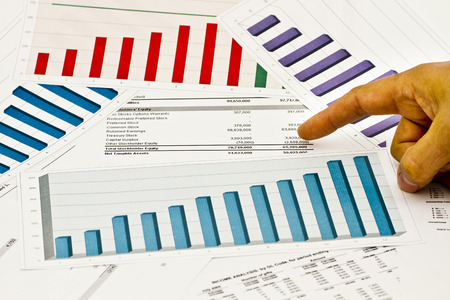 Graps and charts stock market finance finger decisionの写真素材