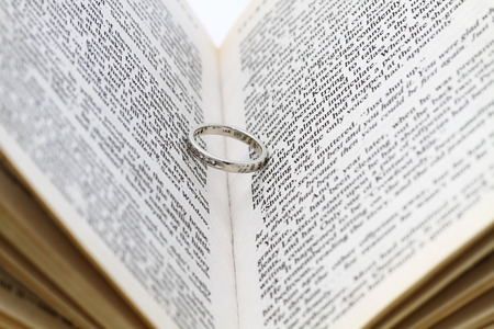 Wedding ring inside of old bookの写真素材