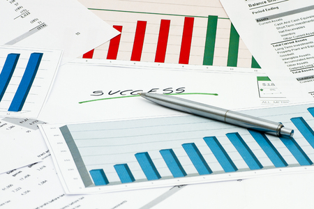 Success with graphs and charts with silver penの写真素材