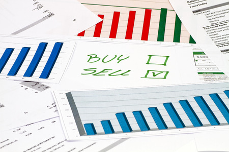 Buy or Sell decision on charts and graphsの写真素材