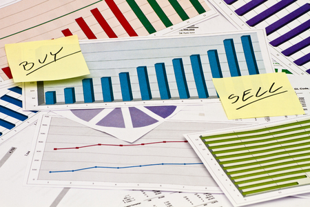Buy or Sell decision on charts and graphsの写真素材