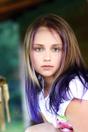 Young cute beauty girl portrait with purple hairsの写真素材