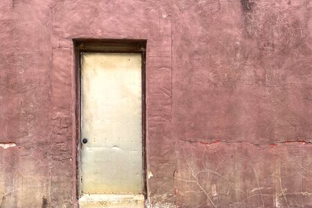an abandoned alley back door od building