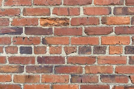 close up of a rustic alley red brick wall building