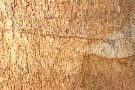gold and yellow rock polished stone wall closeup