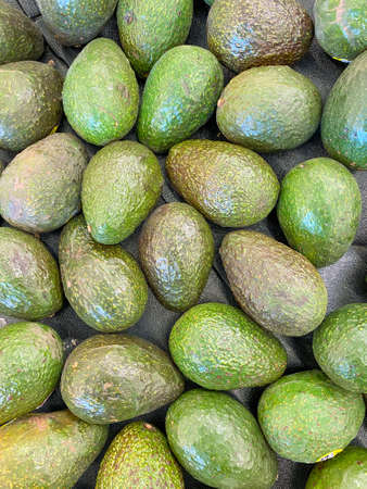 avocado display green bunch parsley at farmers market fresh produce organic vegetable fruit food...