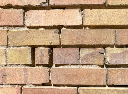 old decayed weathered old brick block garden building wall cracked and abandoned