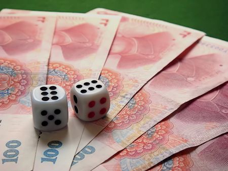 dice on chinese moneyの写真素材