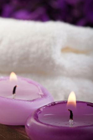 two purple candles and white towel (1)の写真素材