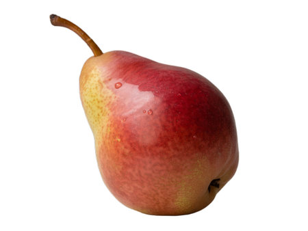 A vibrant, ripe red and yellow pear, isolated on a white background. This high-resolution PNG image showcases the fruit's juicy texture and rich color. Perfect for websites, food blogs, packaging, and other design projects thanks to its transparent background.の写真素材