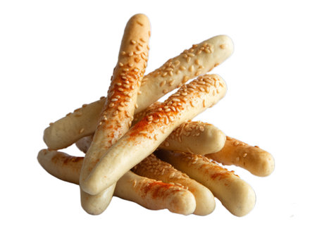 Crispy, golden-brown sesame breadsticks sprinkled with paprika seasoning.  A delicious and crunchy snack, perfect for appetizers or a light meal. This high-resolution, close-up food photography image features a delectable texture and is ideal for recipe websites, food blogs, and culinary publications. The transparent PNG file, on a white background, is suitable for various design projects.の写真素材