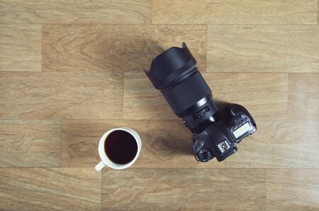 DSLR Camera on wooden tableの写真素材