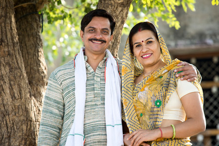 Happy rural Indian farmer with his wife at villageの写真素材