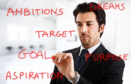 Businessman writing business concepts on the screenの写真素材