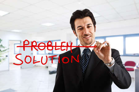Businessman writing a positive concept on the screen