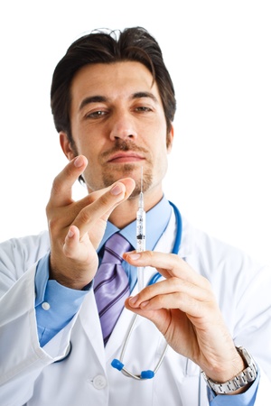 Portrait of a doctor preparing a syringeの写真素材