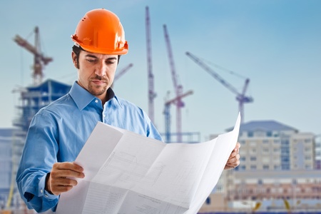 Portrait of a site manager reading a drawingの写真素材