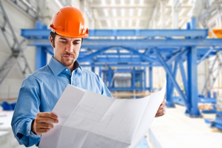 Portrait of a site manager reading a drawingの写真素材