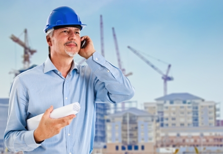 Portrait of a site manager talking at phoneの写真素材
