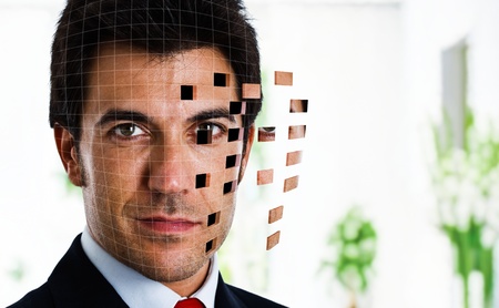 Businessman face shattering into piecesの写真素材