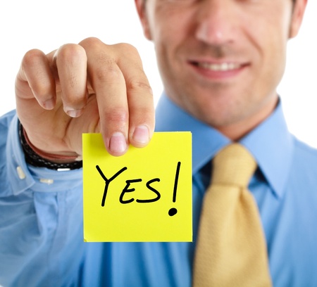 Businessman answering to a question using a post-itの写真素材
