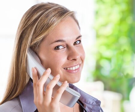 Beautiful woman talking on the phoneの写真素材