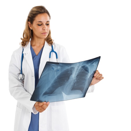 Portrait of a female doctor looking at a chest X-rayの写真素材